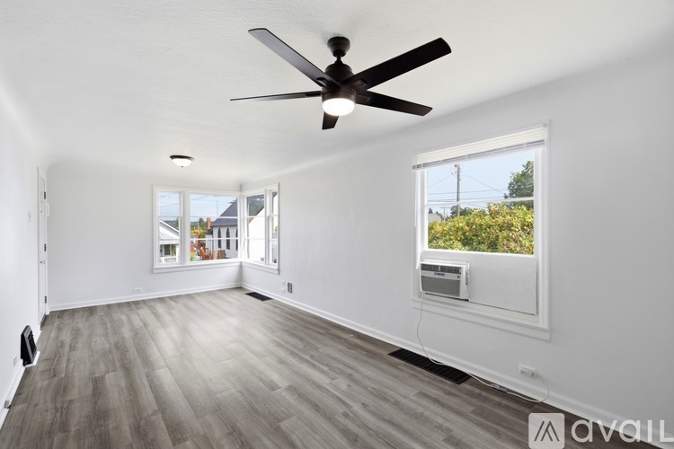 A doorway with a fan in the room.