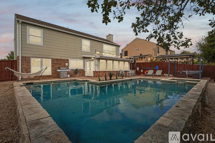 A house with a pool in the backyard.