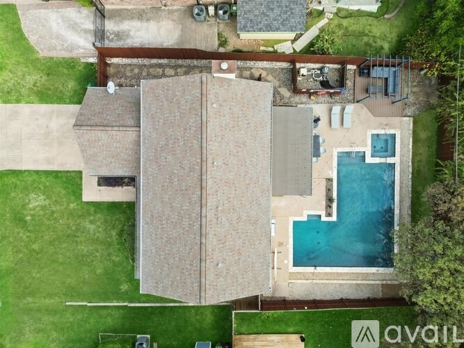 A house with a pool in the backyard.