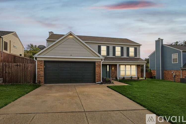 A house with a garage is available for sale.