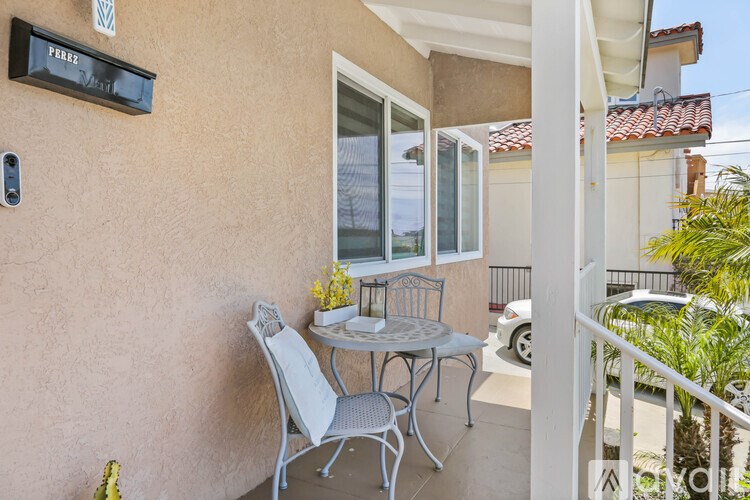 A patio with a table and chairs is shown.