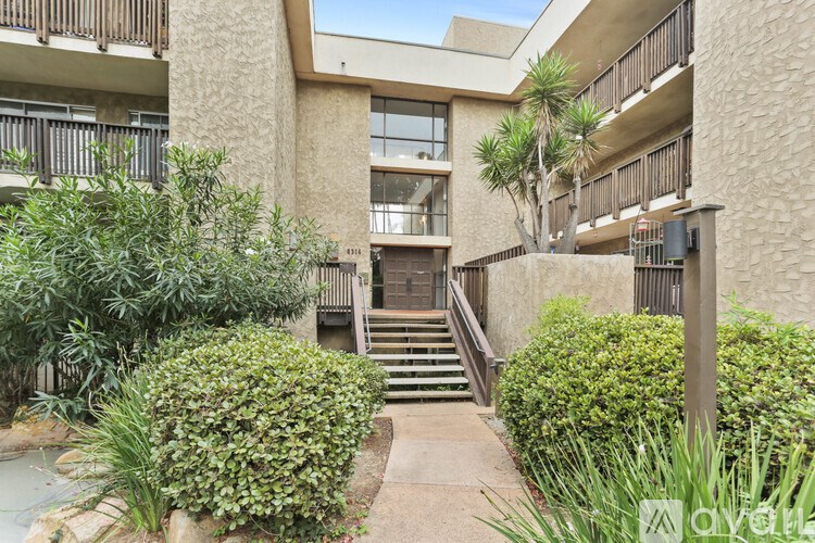 A building with a garden in front of it.