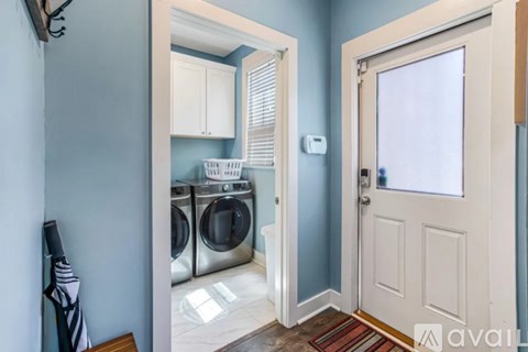 A laundry room with a washer and dryer.