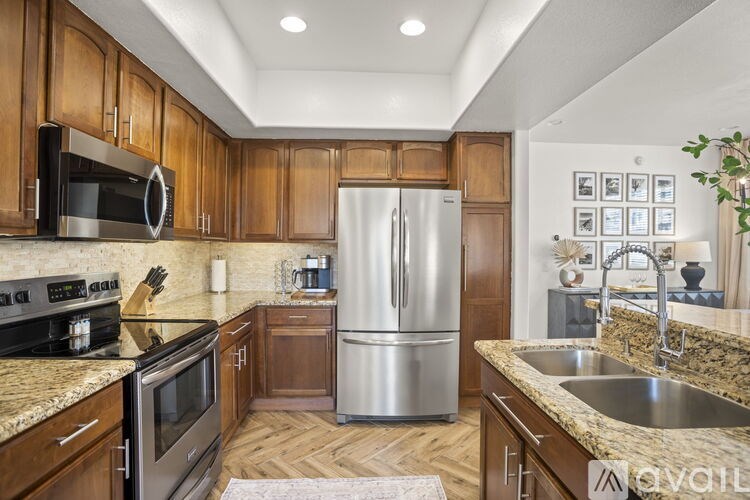 A kitchen with wooden cabinets and stainless steel appliances is on the market.