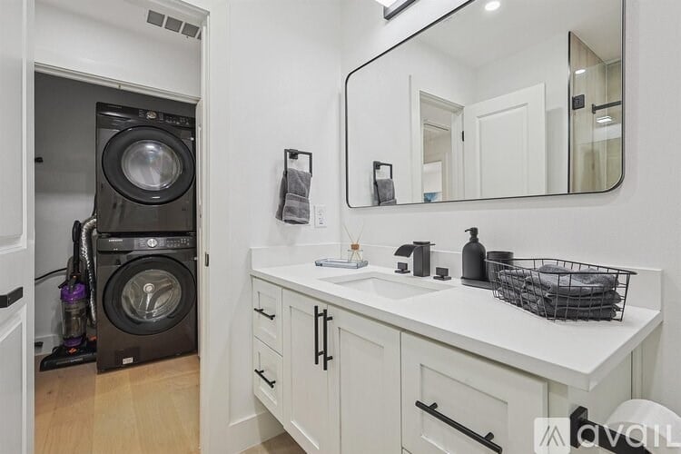 A laundry room with a washer and dryer in it.