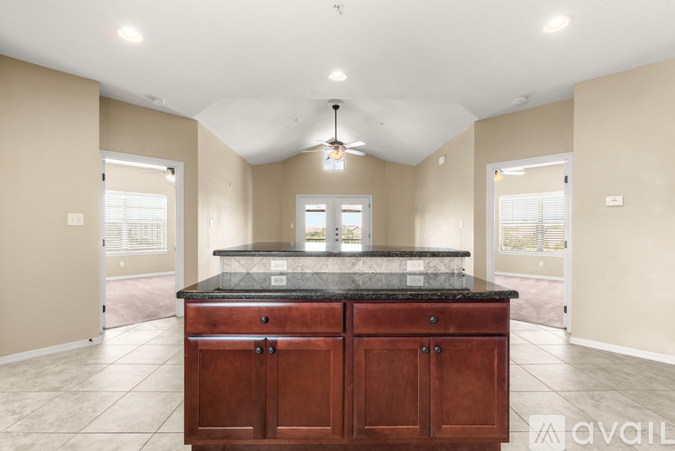 A kitchen with a large island in the middle of the room.