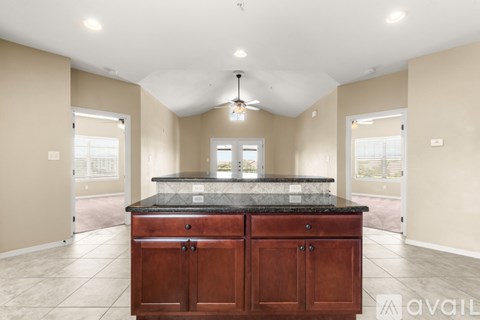 A kitchen with a large island in the middle of the room.