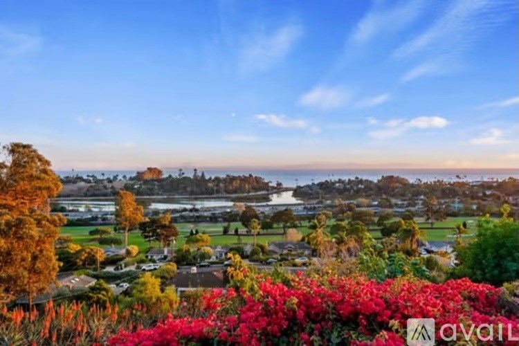 A beautiful landscape with a clear blue sky and a few clouds.