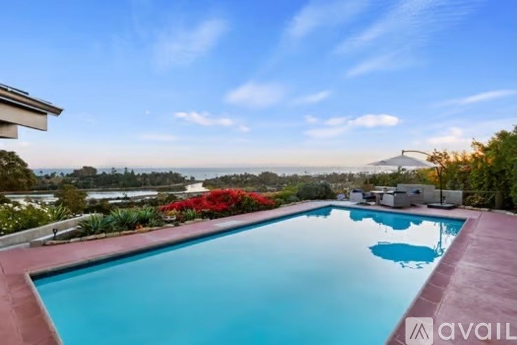 A swimming pool with a view of the ocean.