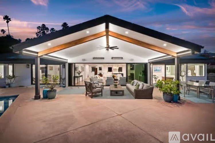 A modern house with a pool in the backyard.