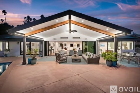 A modern house with a pool in the backyard.