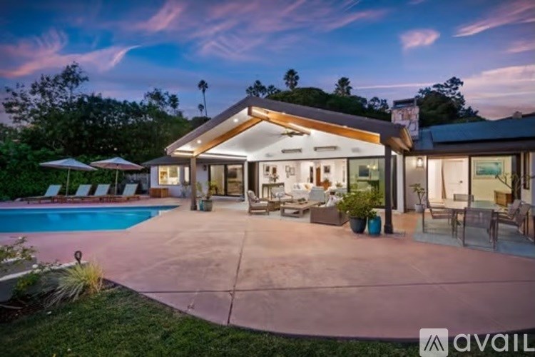 A house with a pool in the backyard.
