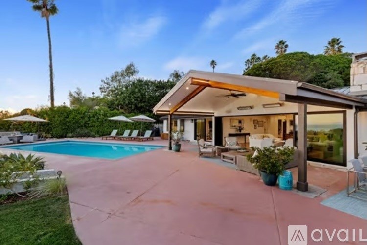 A house with a pool in the backyard.