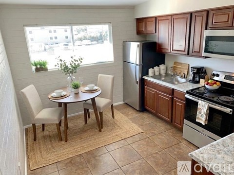 A kitchen with a refrigerator, sink, and stove is advertised for rent.