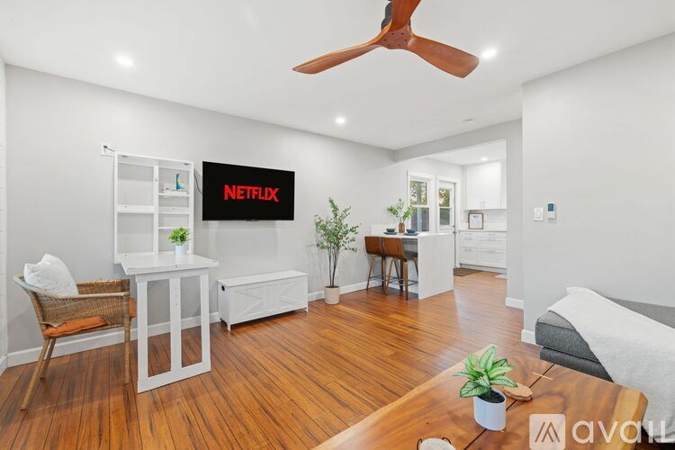 A bathroom with a white sink and a mirror above it.