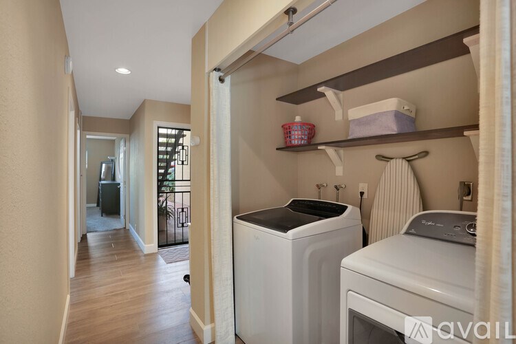 A laundry room with a washer and dryer.