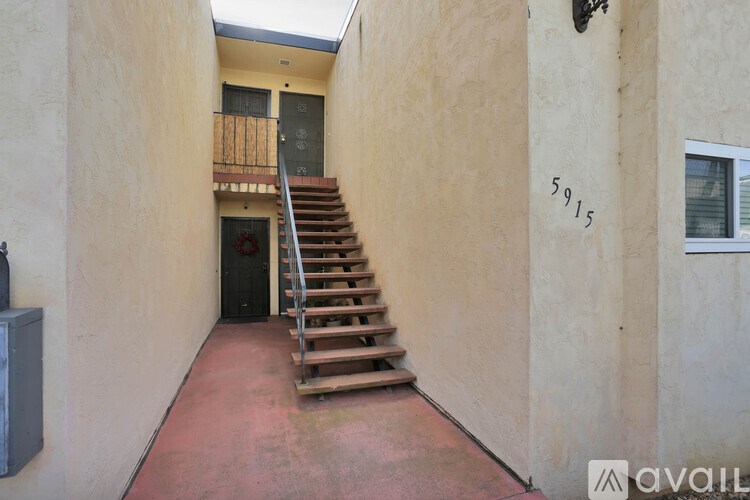 A staircase in a building with the number 5915 on the wall.