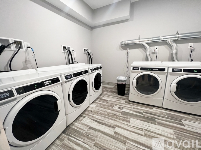 A row of washing machines in a laundromat.