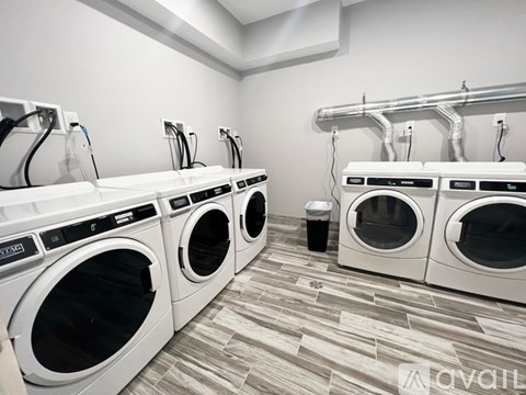 A row of washing machines in a laundromat.