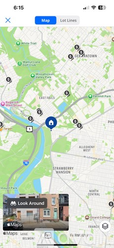 A map application is open on a phone screen, displaying a map of a city with various locations marked.