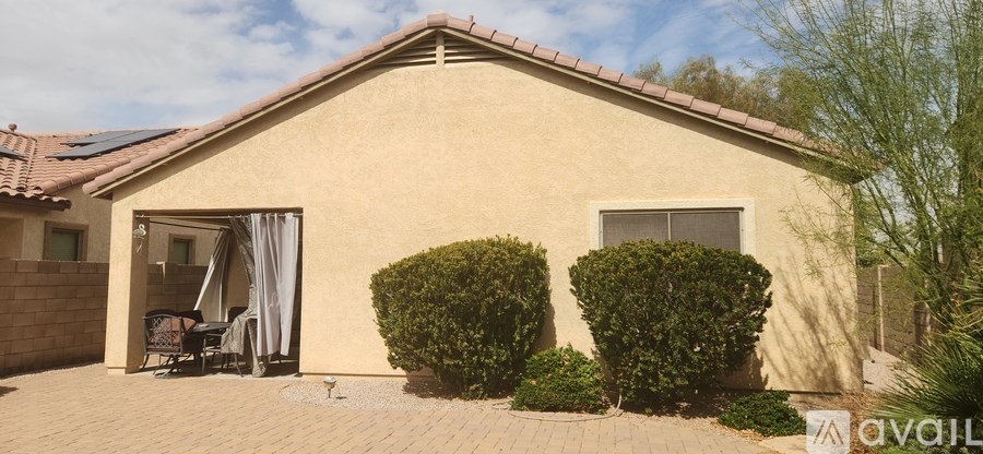 A house with a patio and a garden.