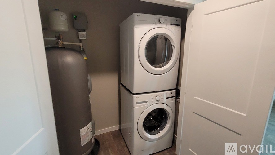 A washing machine and dryer in a small laundry room.