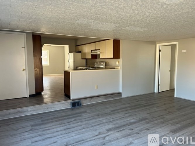 A kitchen area with a sink and cabinets.