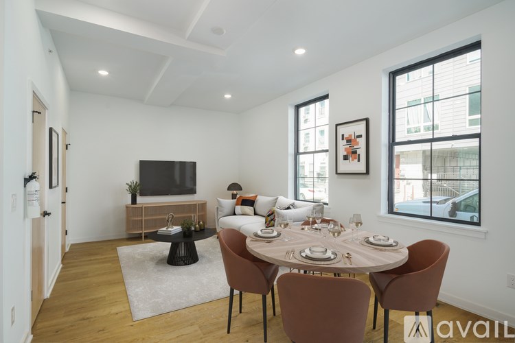 A dining room with a round table set for six.