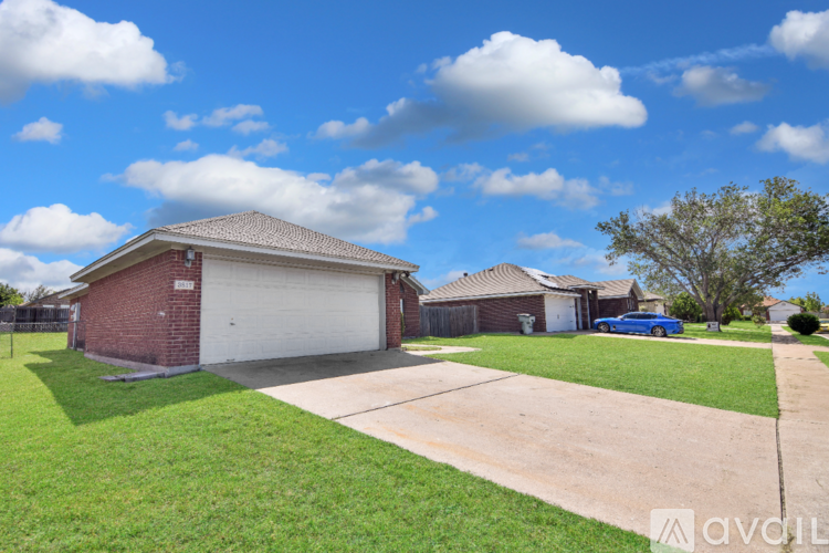 A house with a garage and a driveway.