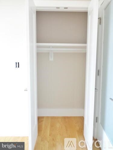 A white closet with a door numbered 11.