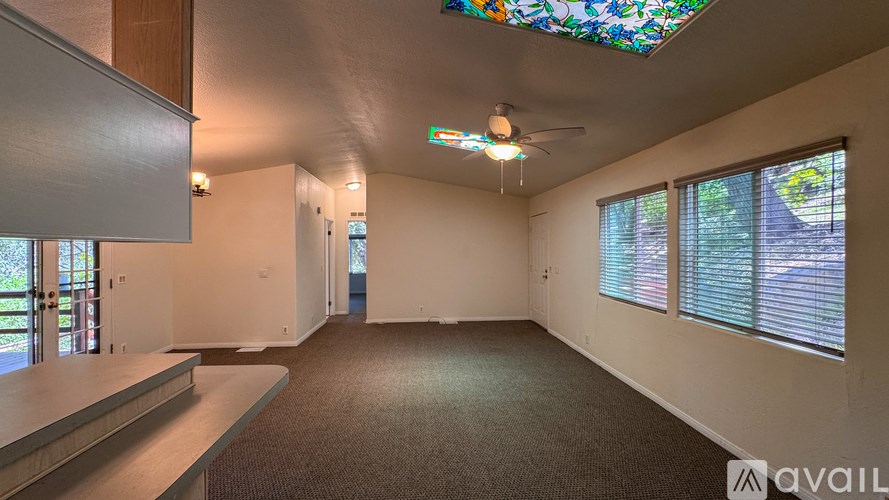 A white bathroom with a toilet, sink, and bathtub.