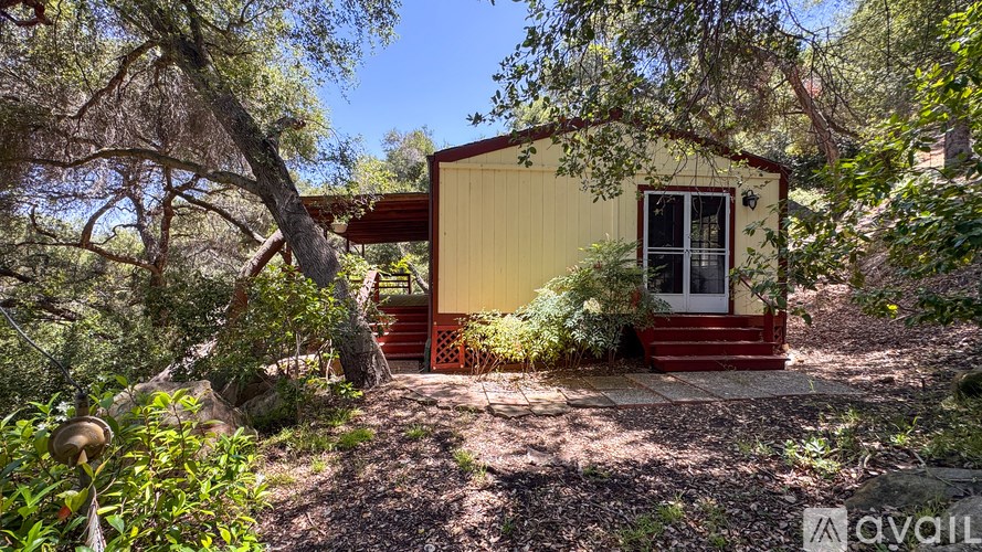 A room with a stained glass window and a carpeted floor.