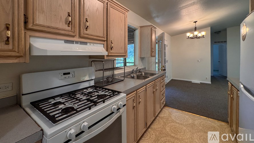 Stained glass windows in a room with a ceiling fan.