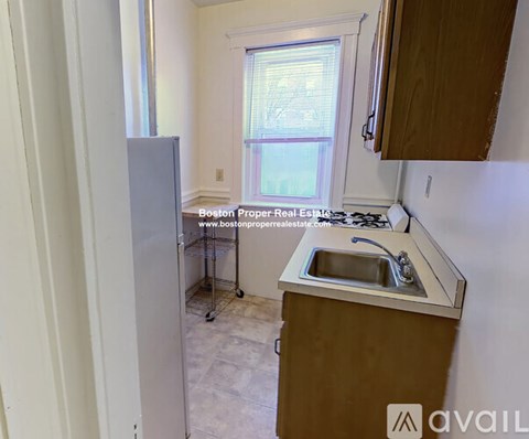 A kitchen with a sink and a window.