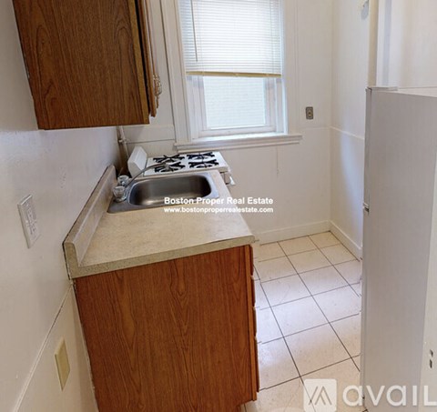 A kitchen with a sink and a window.