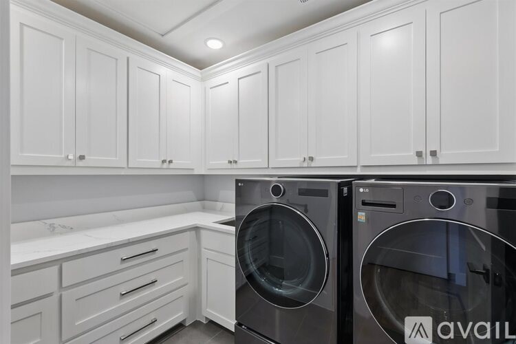A laundry room with a washer and dryer.