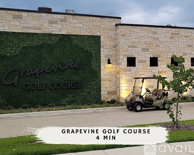 A sign for Grapevine Golf Course is displayed on a stone wall.