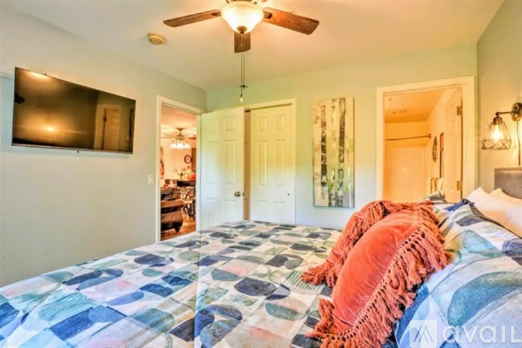 Bedroom with a bed and a ceiling fan.