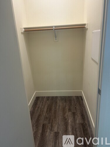 A living room with a grey couch and a coffee table.