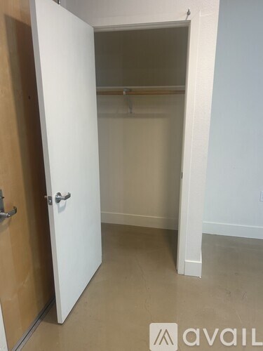 A modern kitchen with a stove top oven and a microwave above the counter.