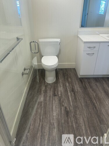 A bedroom with a large bed and a blue comforter.