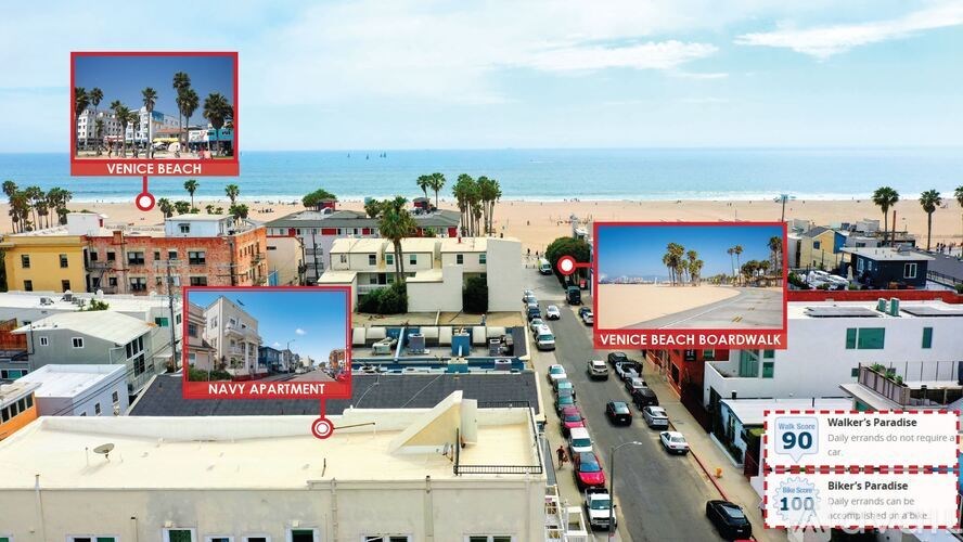 A living room with a grey couch, a white table, a television, and a window.