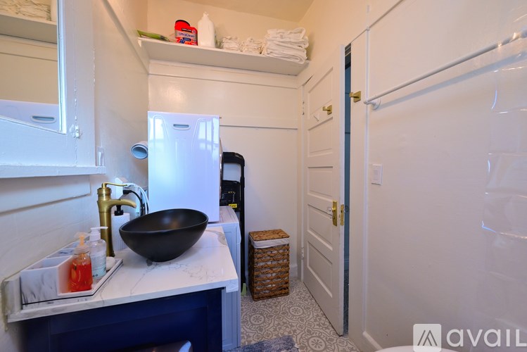 A white toilet sits next to a bathtub in a bathroom.