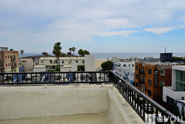 A view of a cityscape with a pier and buildings.