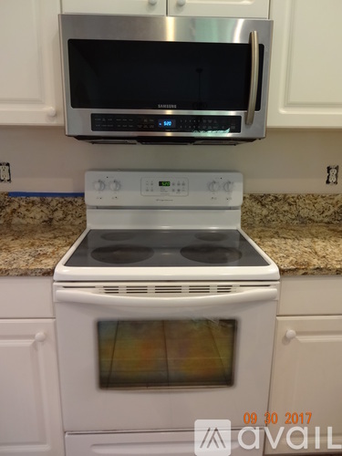 A white oven with a glass door is in a kitchen.