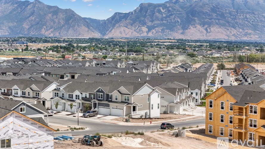 A housing development with mountains in the background.
