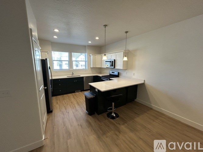 A room with a desk and a chair in it.