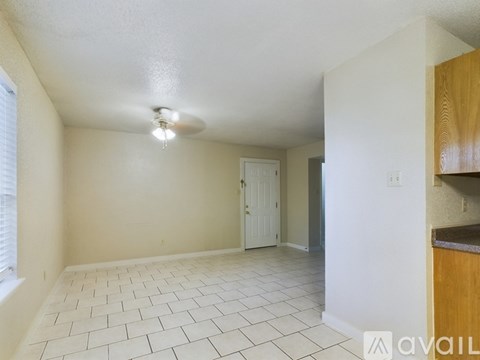 A room with a tiled floor and a ceiling light.