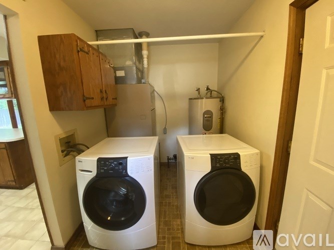 A laundry room with a washer and dryer.