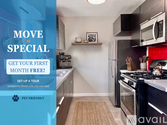 A kitchen with a red wall and a sign offering a free month.